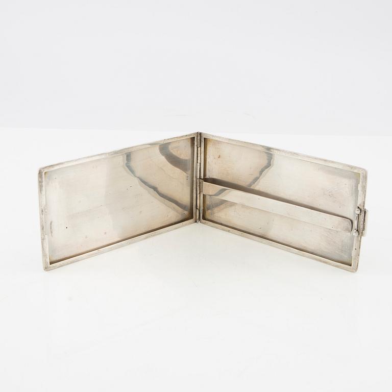 American silver cigarette case with engraving from World War II.