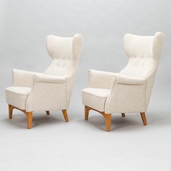 A 1950's pair of 'Inkeri' armchairs manufactured by Asko Finland after a Danish model.