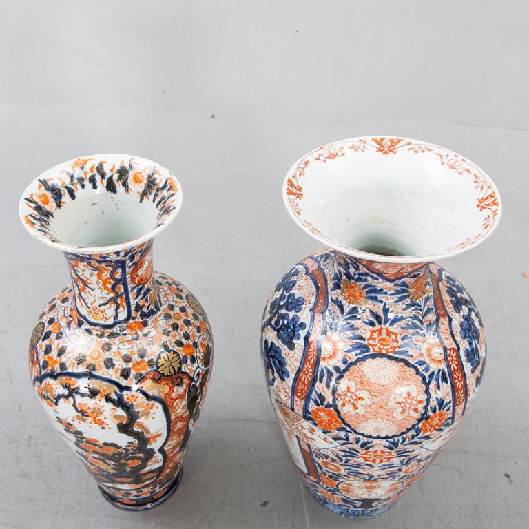 A set of two Japanese porcelain Imari floor urns.