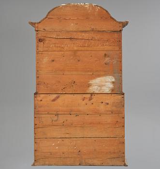 A polychrome-painted folk art cabinet from Värmland, Sweden, dated 1818.