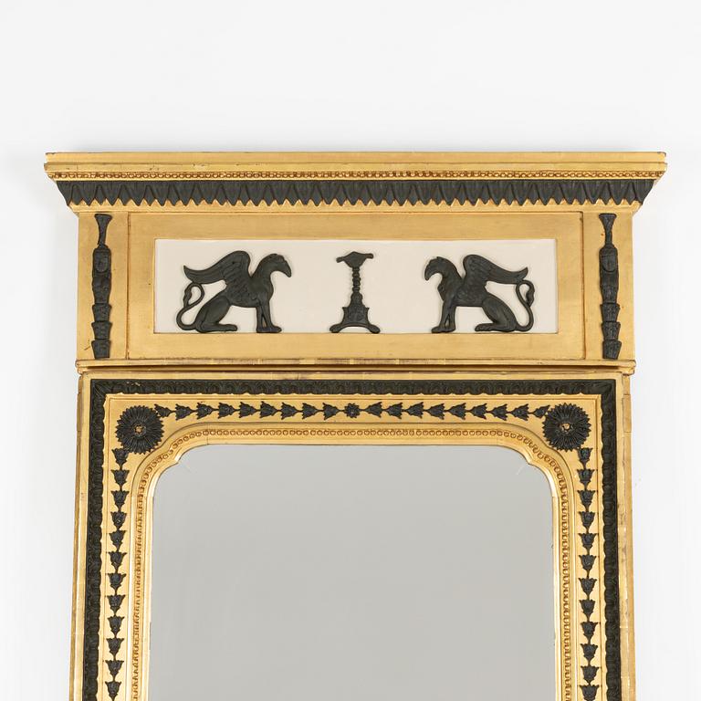 A Swedish Empire giltwood and bronzed mirror attributed to Jonas Frisk (master in Stockholm 1805-24).