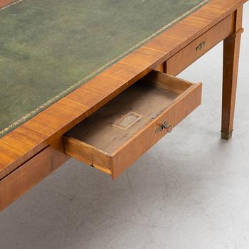 An mahogany veneered Empire style library table by Lorentz Wilhelm Lundelius Stockholm 1818-1857.