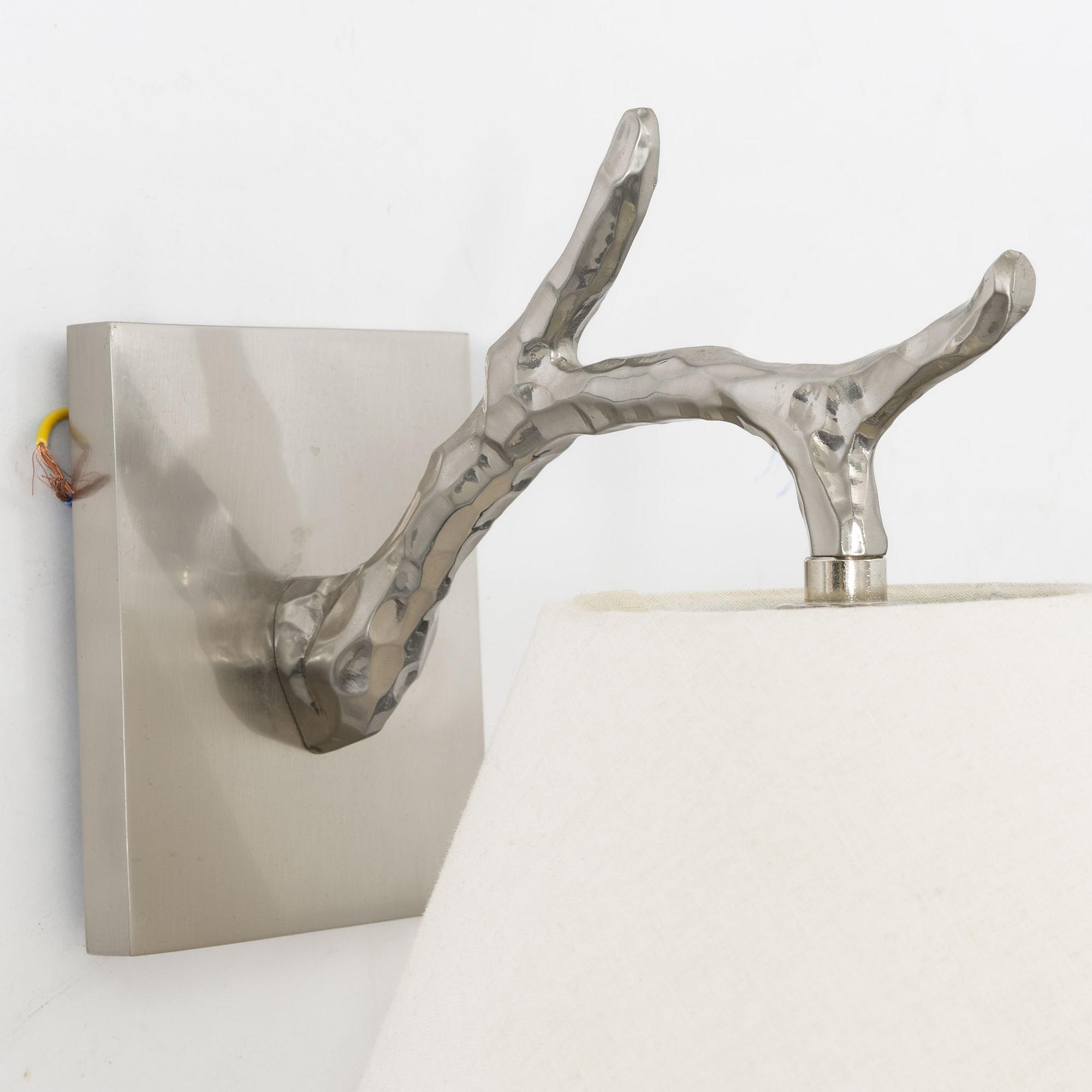 A pair of 'Twig Down' wall lamps, Vaughan, United Kingdom.