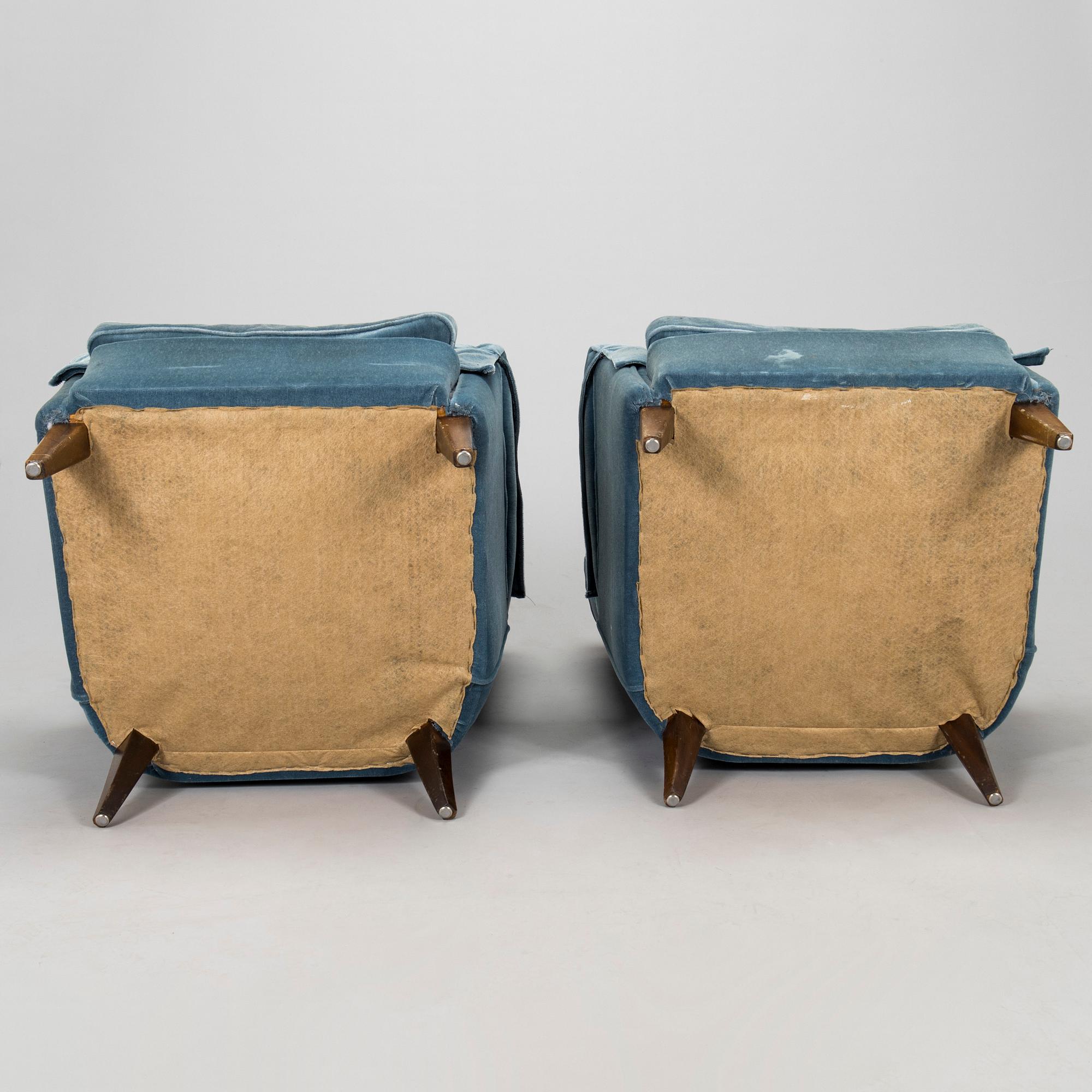 A pair of mid-20th century armchairs.
