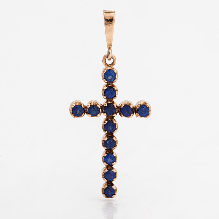 A 14K gold cross pendant with sapphires. Russia, 21st-century.