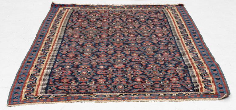 An antique Senneh kilim, West Persia, c. 149 x 11 cm.