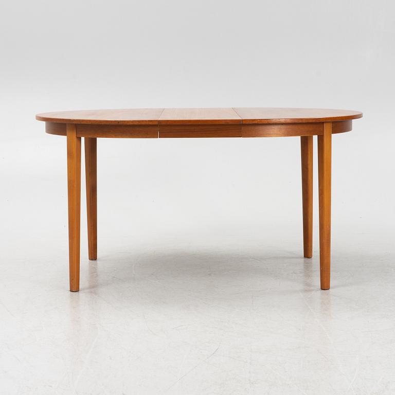 A teak-veneered dining table, second half of the 20th century.