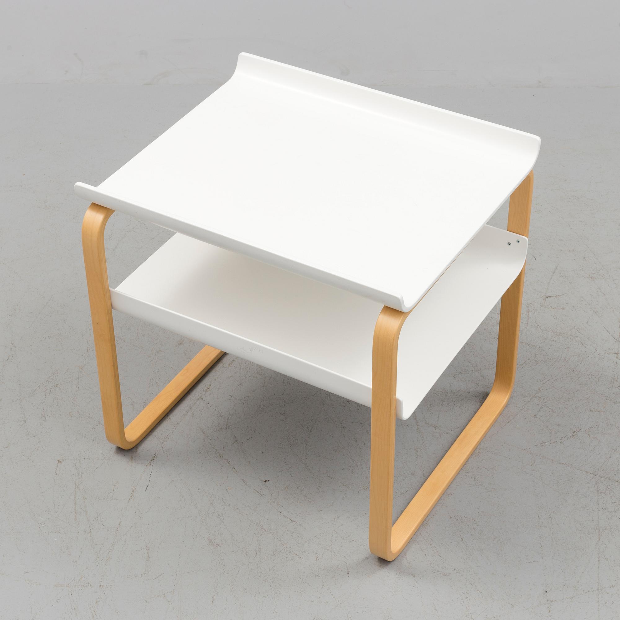 An occational table model 915 by Alvar Aalto for Artek.