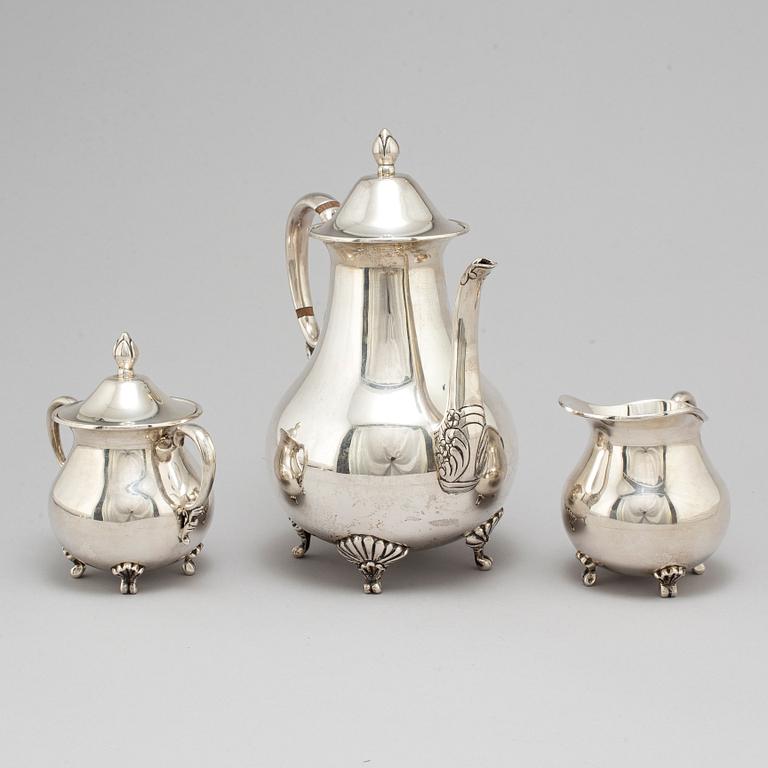 A sterling silver coffee pot, creamer and sugar bowl, 20th century.