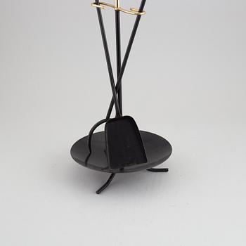 A fireplace stand of three parts by Gunnar Ander for Ystad Metall.