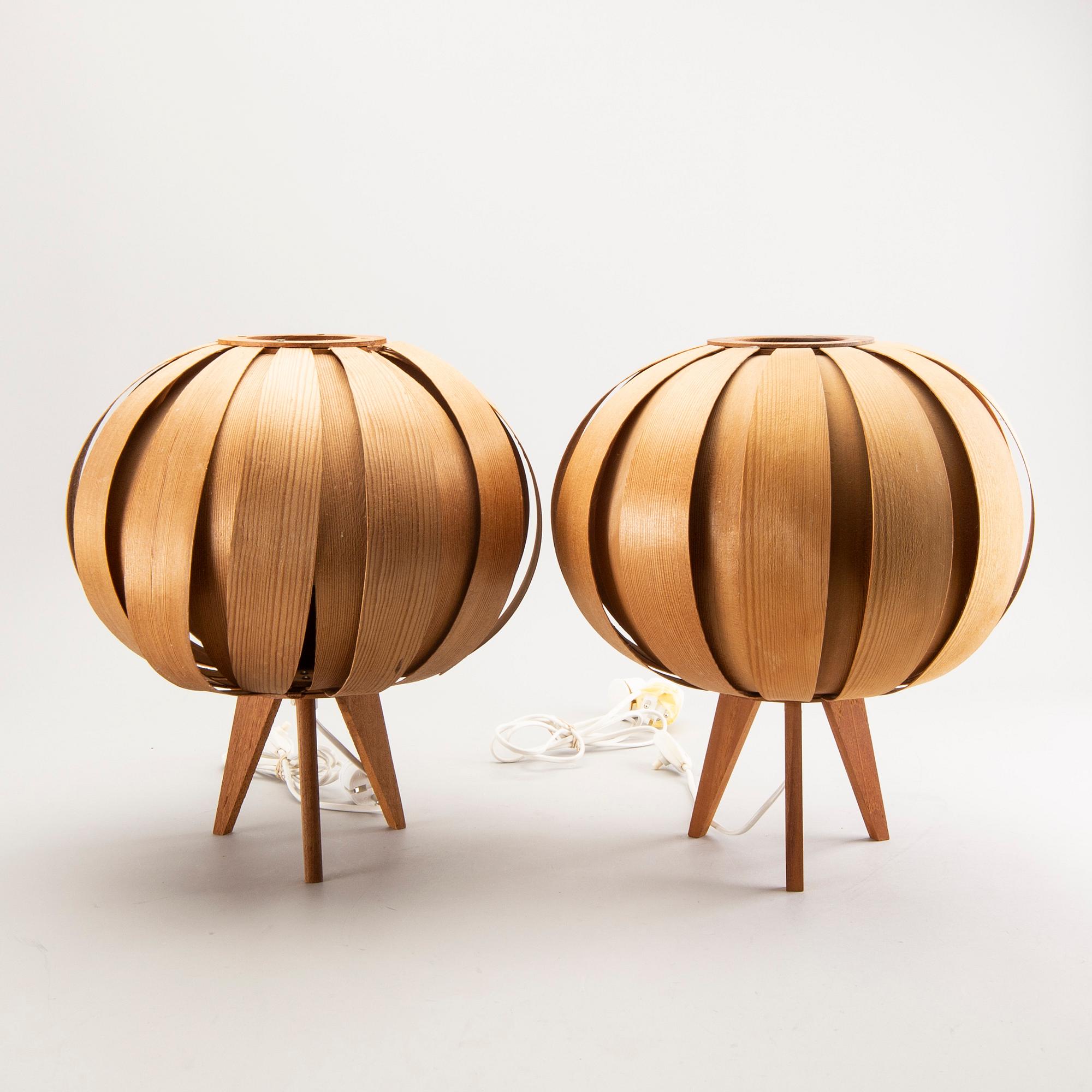 A pair of wooden table lamps.