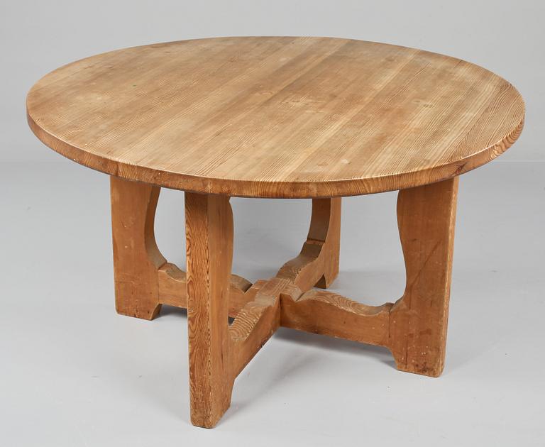 A stained pine dining table, attributed to Axel Einar Hjorth, Nordiska Kompaniet, 1930's.