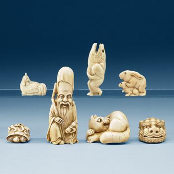 A set of six ivory netsukes and an Okimono, Japan, Meiji (1868-1912).