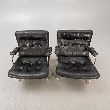 A pair of Bruno Mathsson karin leather and chrome easy chairs for DUX later part of the 20th century.