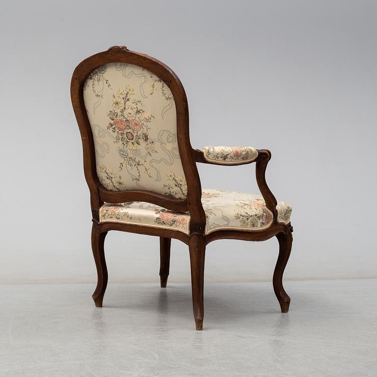 A mid 18th century Rococo arm chair.