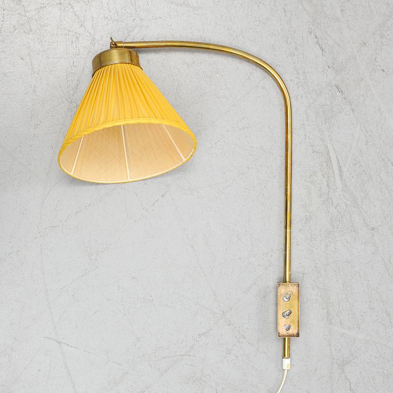 A model 2484 brass wall light by Josef Frank for Firma Svenskt Tenn.