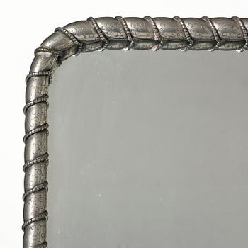 Estrid Ericson, a pewter framed mirror model "A 2518", Firma Svenskt Tenn, Stockholm, 1947.