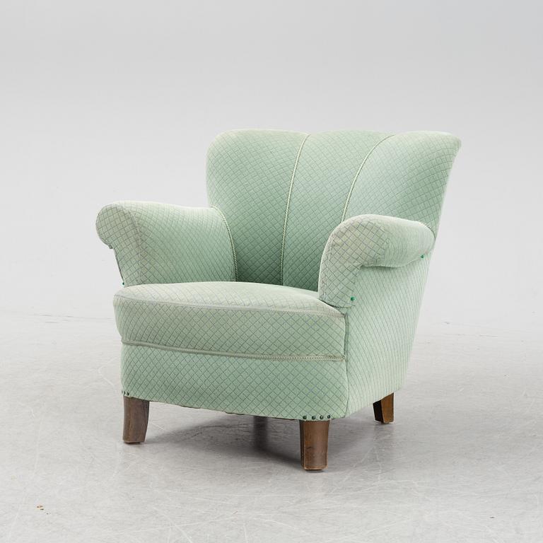 A mid 20th Century sofa and easy chair.