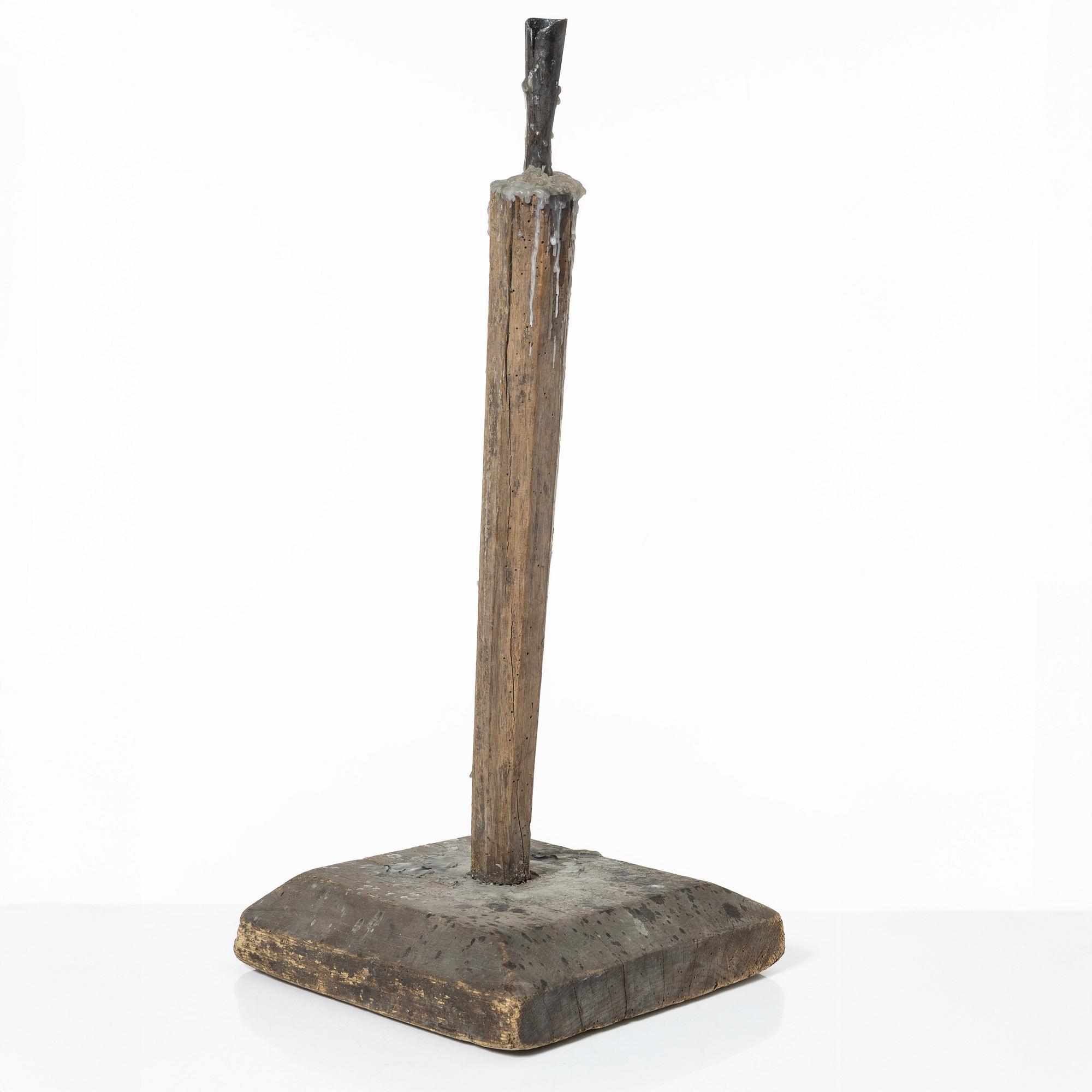 A candle stick, 19th/20th Century.