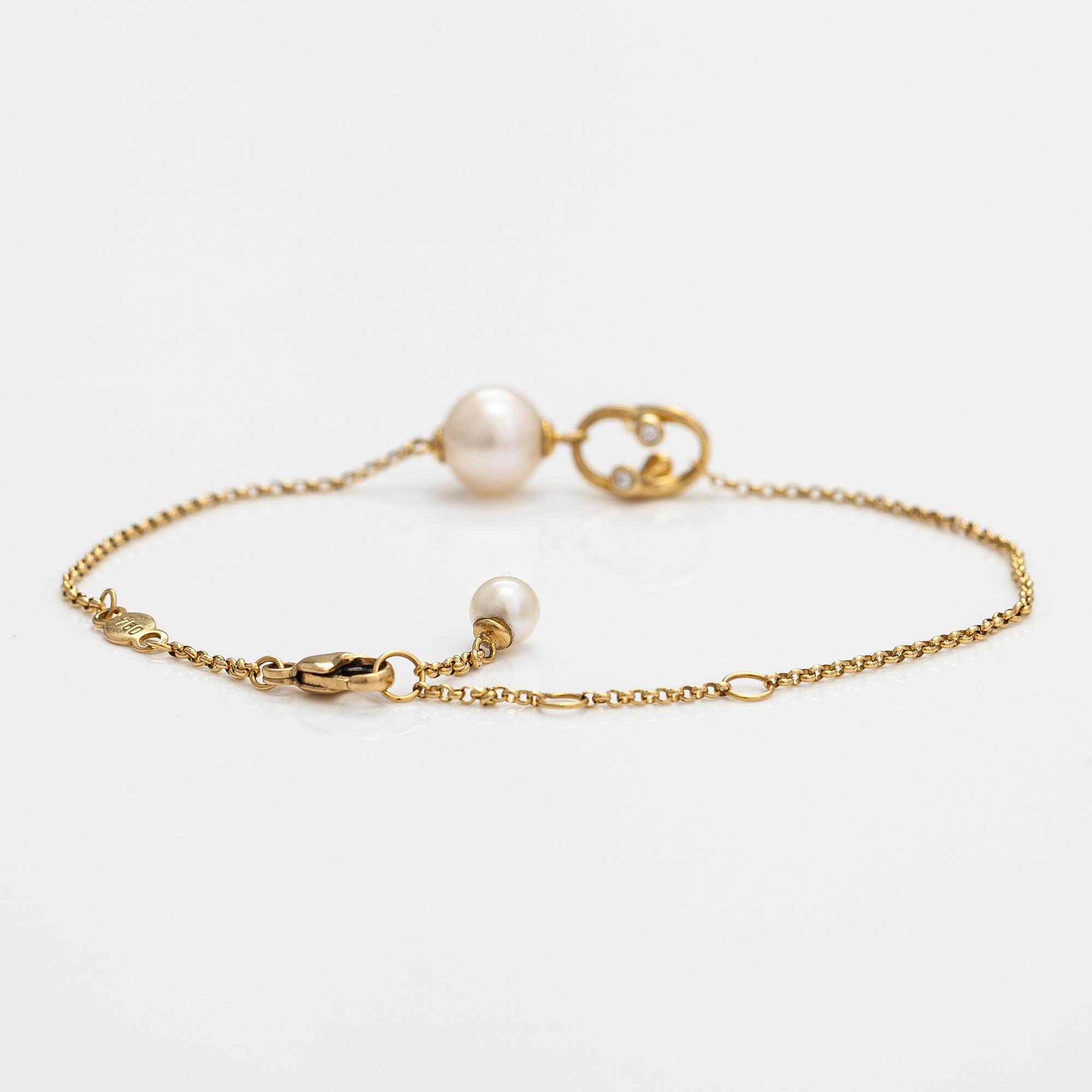 Georg Jensen, An 18K gold bracelet "Magic" with a cultured pearl and diamonds ca. 0.048 ct in total, Denmark.