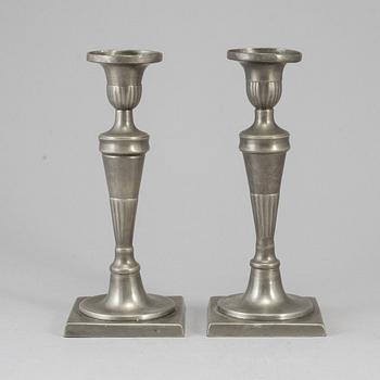 A pair of 18th century pewter candlesticks.