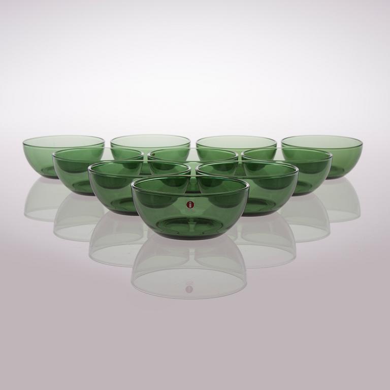 A set of 22 glass dessert bowls in three colours, Iittala, Finland, late 20th century.