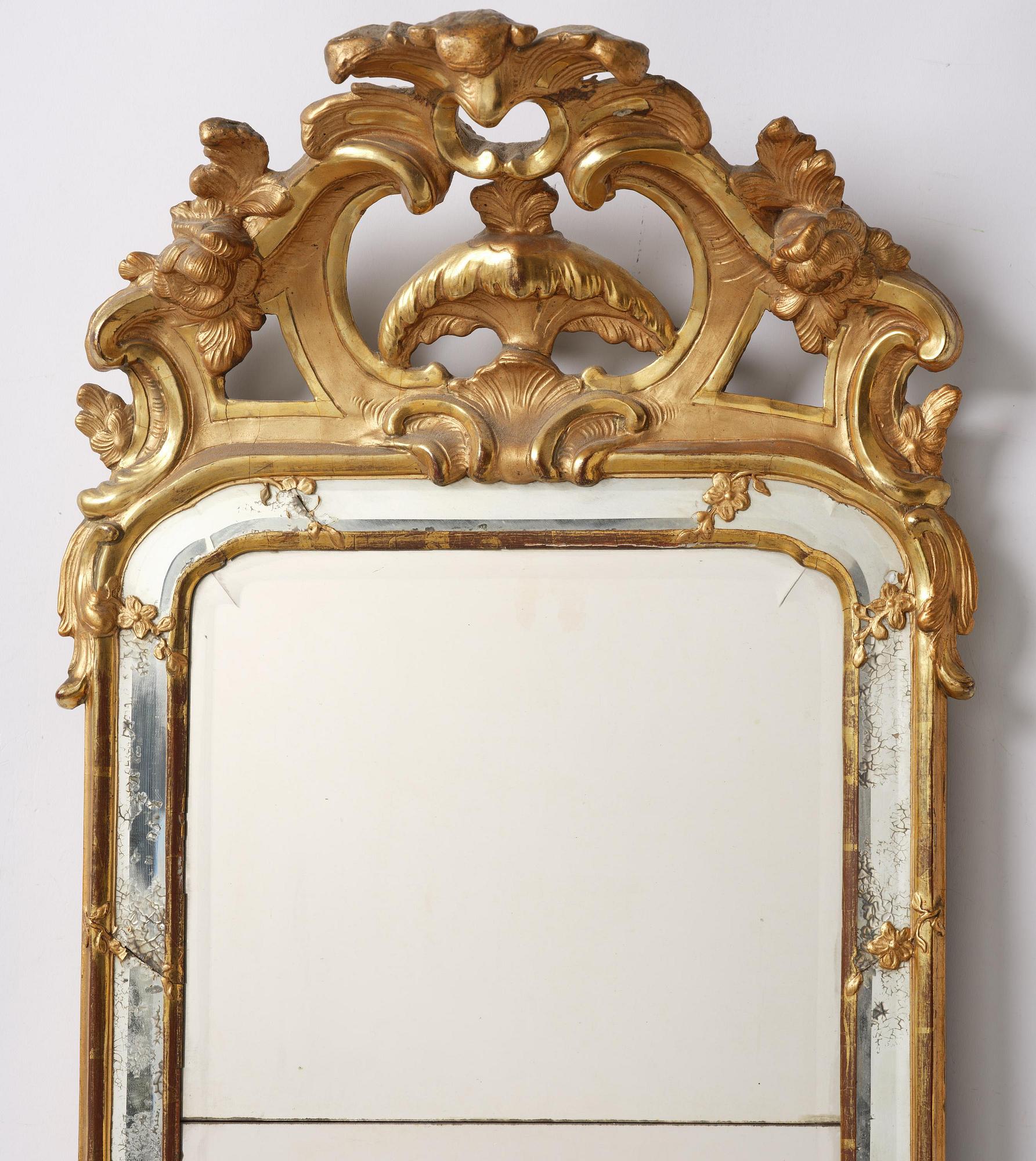 A rococo giltwood mirror, Stockholm, later part 18th century.