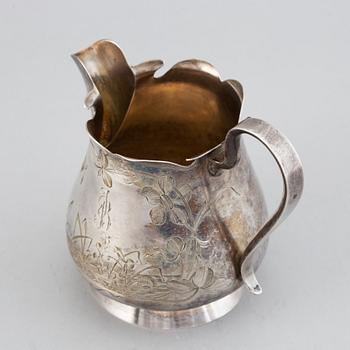 A Russian late 19th / early 20th century parcel-gilt silver cream-jug.