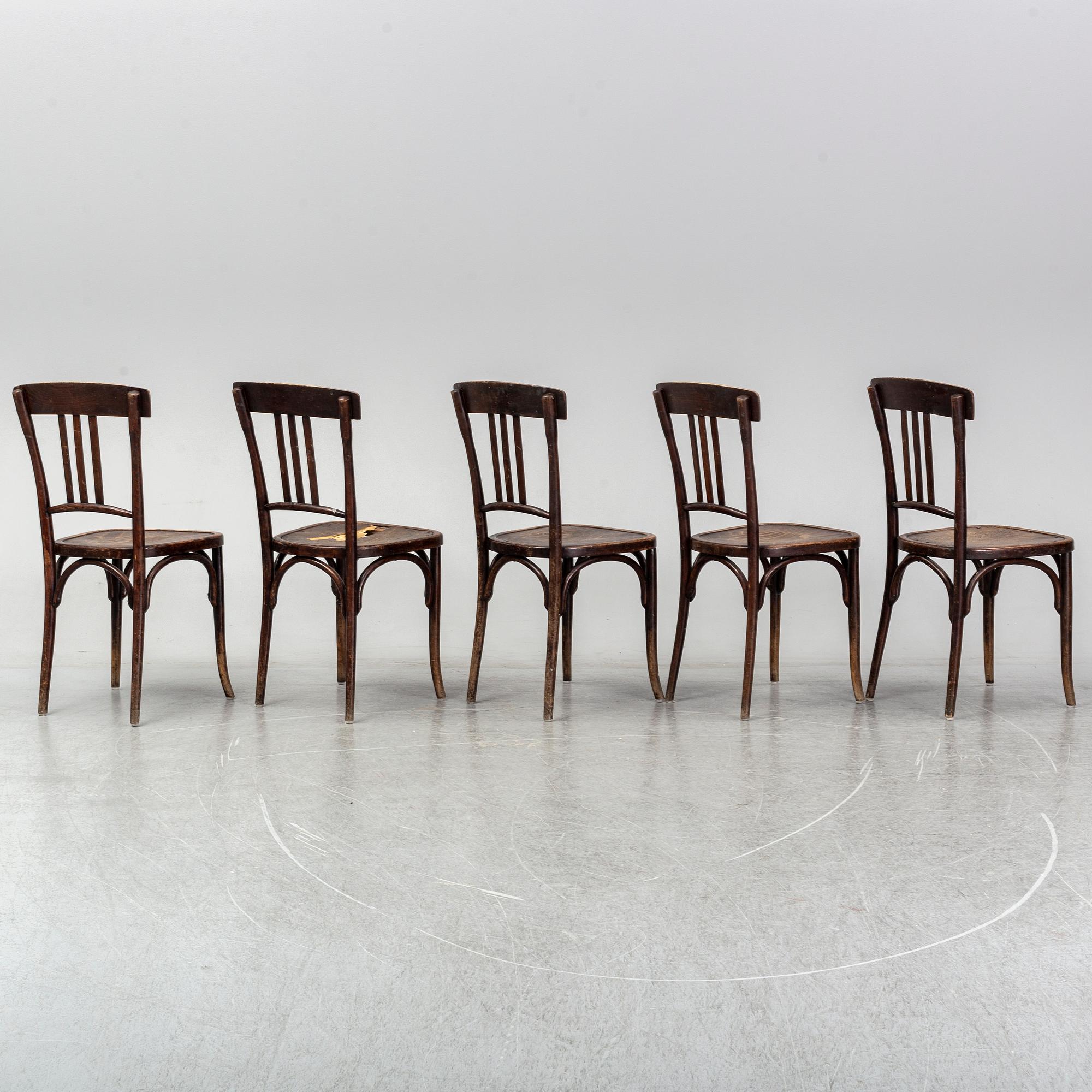 A matched set of four wooden chairs, first half of 20th Century.