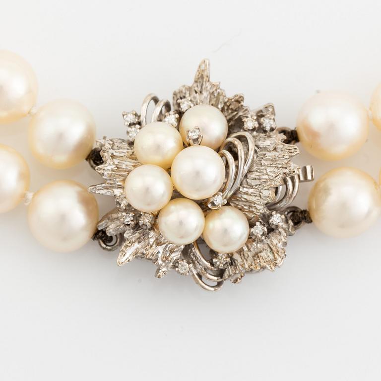 Cultured pearl necklace, clasp 14K white gold with pearl and eight cut diamonds.