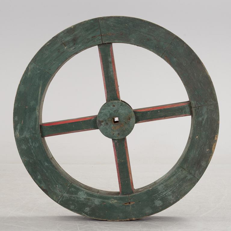 A early 20th century wooden wheel.