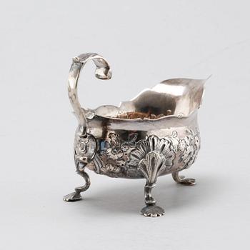 A silver sugar shaker, salt shaker and creamer, 19th-20th century.