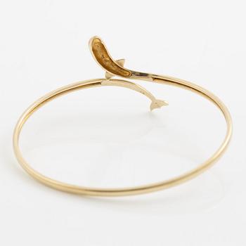Bracelet/arm ring, 14K gold in the form of a dolphin.