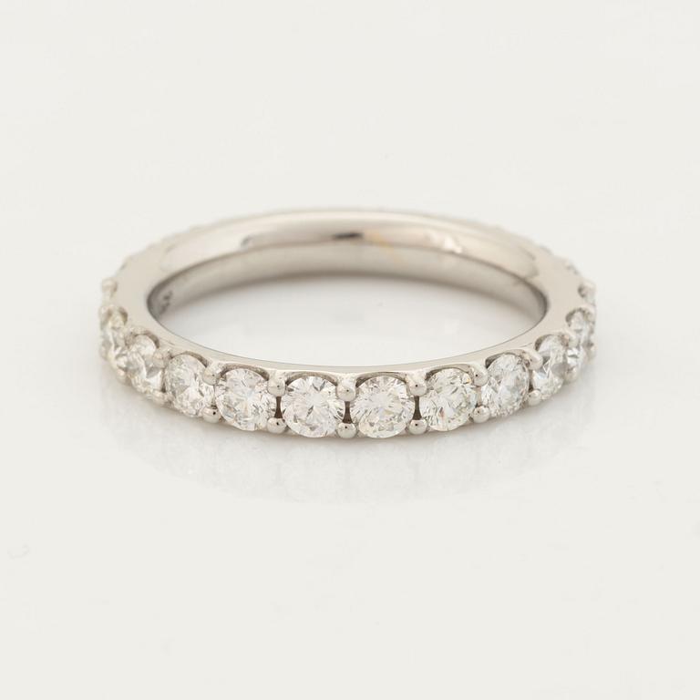 Brilliant cut diamond eternity ring.