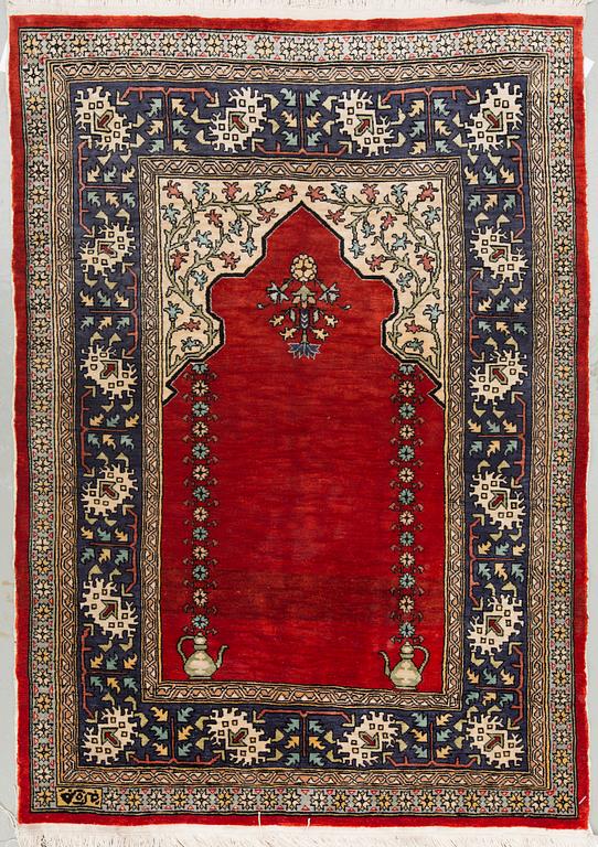 An oriental silk rug, around 73 x 53 cm.