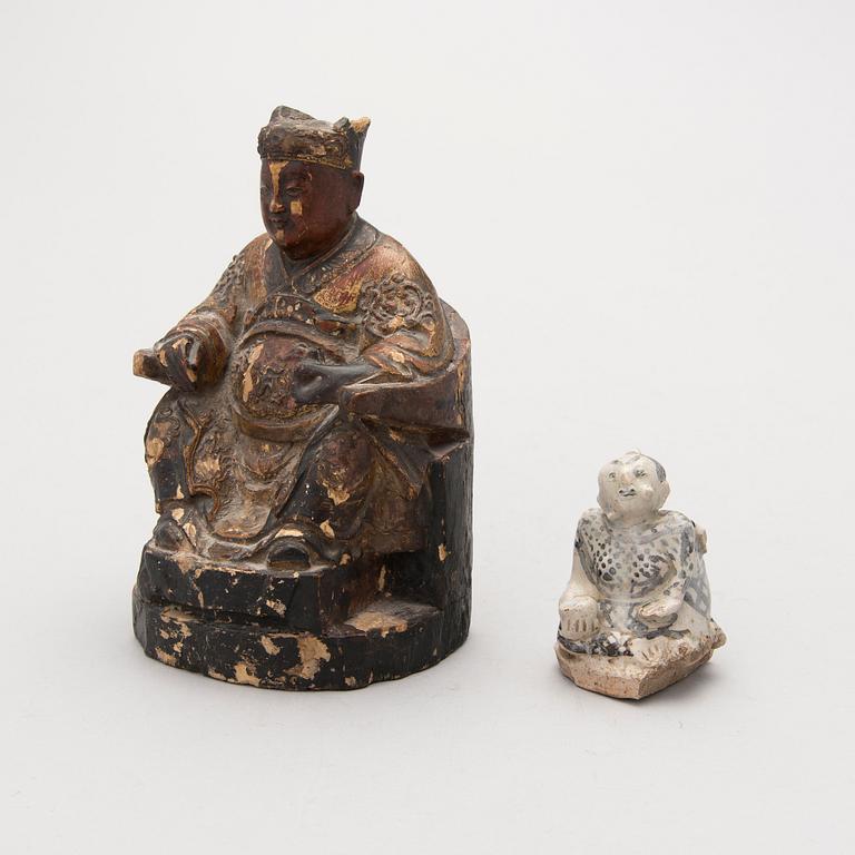 TWO FIGURINES, one possibly Chinese 19th Century and the other possibly 14th-15th Century Southeast Asian.