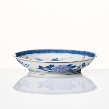 A doucai '100 antiques' dish, Qing dynasty, 18th Century with a Ming mark.