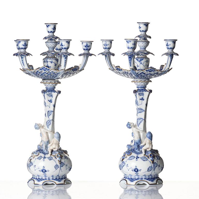 A pair of Royal Copenhagen 'Musselmalet' / 'blue fluted full lace' six-light candelabras, Denmark, 1898-1923.
