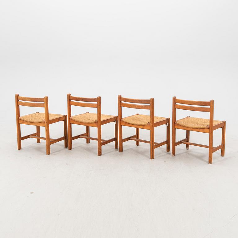A set of four 1970s pine chairs.