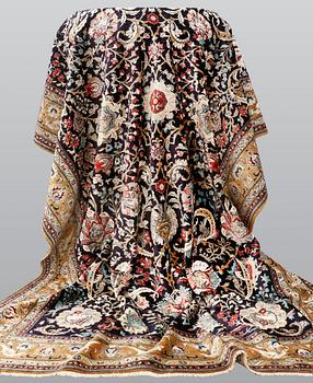 A silk Ghom carpet, 309 x 200 cm.