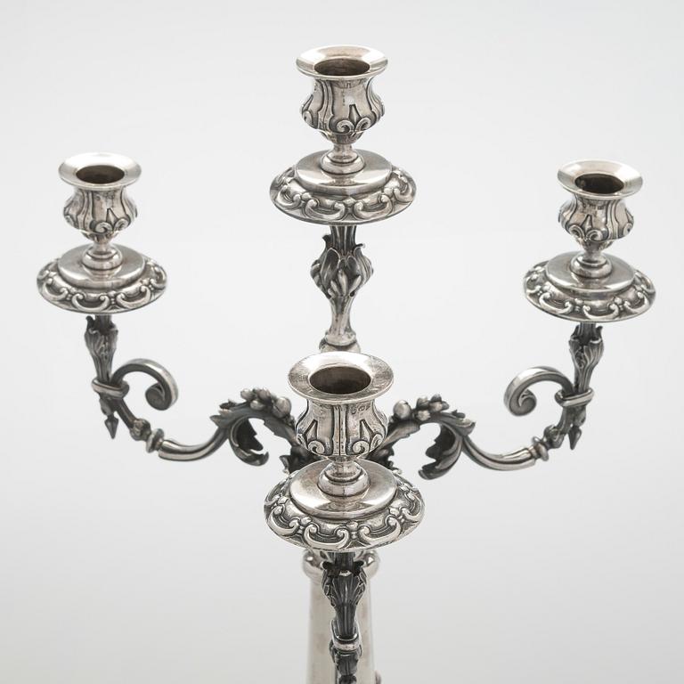 A pair of silver candelabra, maker marks of Carl Johan Tegelsten, Saint Petersburg 1850.