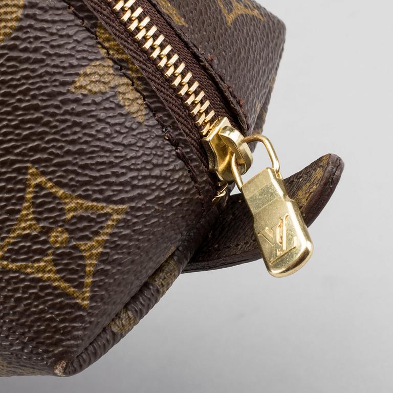 A LOUIS VUITTON COSMETIC POUCH.