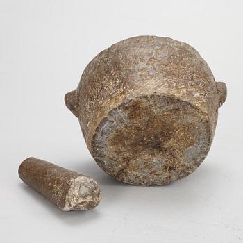 A llimestone mortar and pestle, 18th/19th Century.