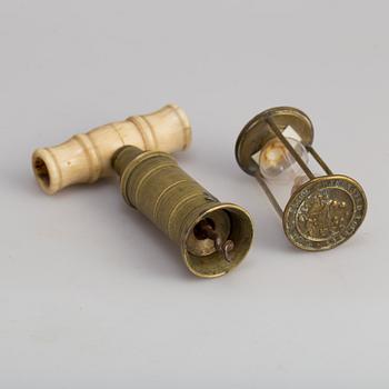 A brass cork screw and hourglass 19th century.