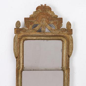 A Gustavian giltwood mirror, Stockholm, late 18th century.