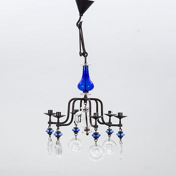 ERIK HÖGLUND, a cast iron and glass chandelier.