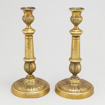 A pair of Empire bronze candlesticks, first half of the 19th century.