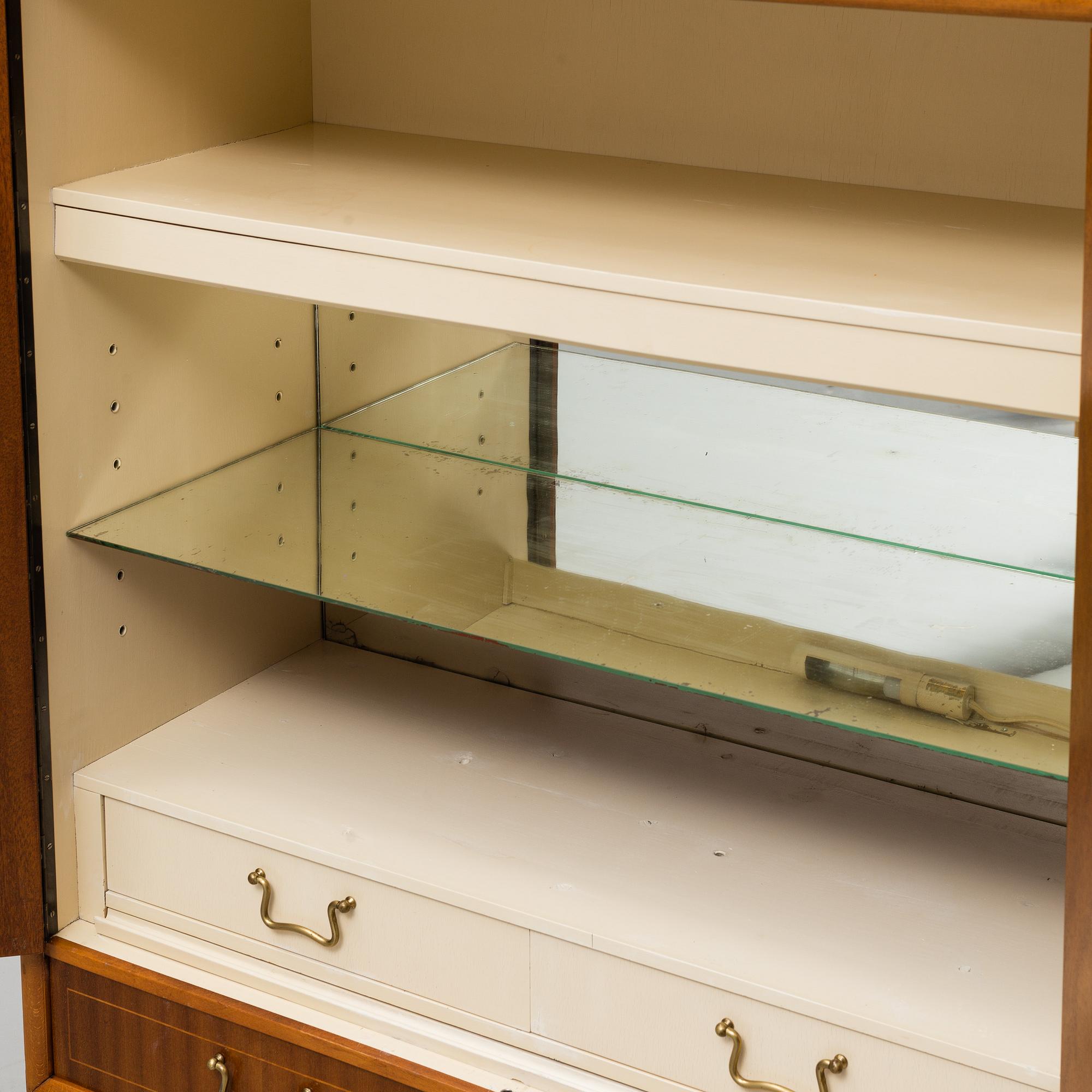 A mid 20th Century bar cabinet.