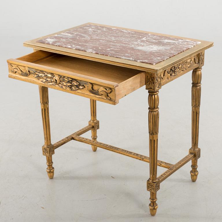 A Louis XVI-style table, first half of the 20th century.