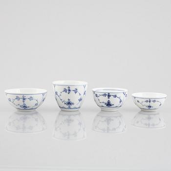 A group of four 'Blue Fluted' / 'Musselmalet rifflet' cups with saucers, Royal Copenhagen, 19th century and later.